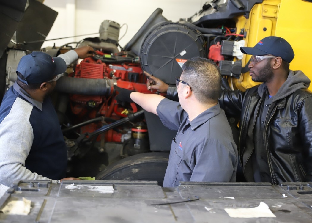 Diesel Technology students working on the cab of a semi truck