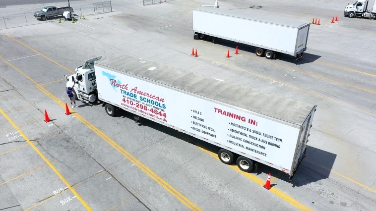 Drone view of NATS training yard with two semi trucks